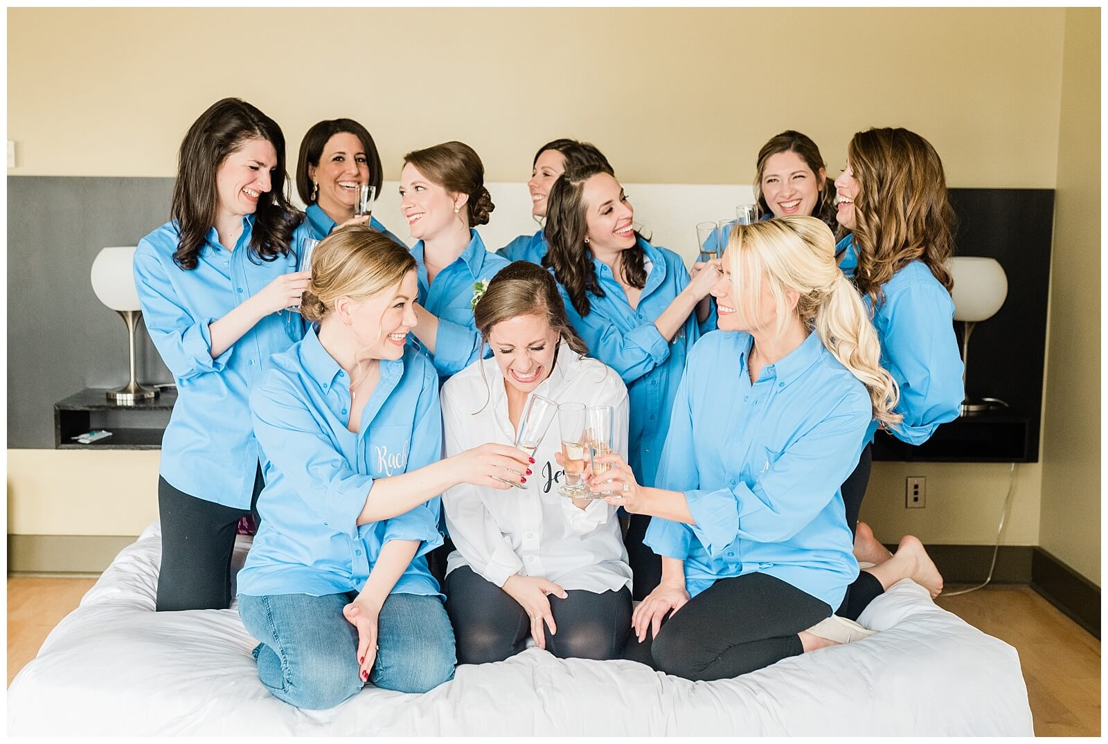 A bride and her bridesmaids enjoying champagne before getting ready.