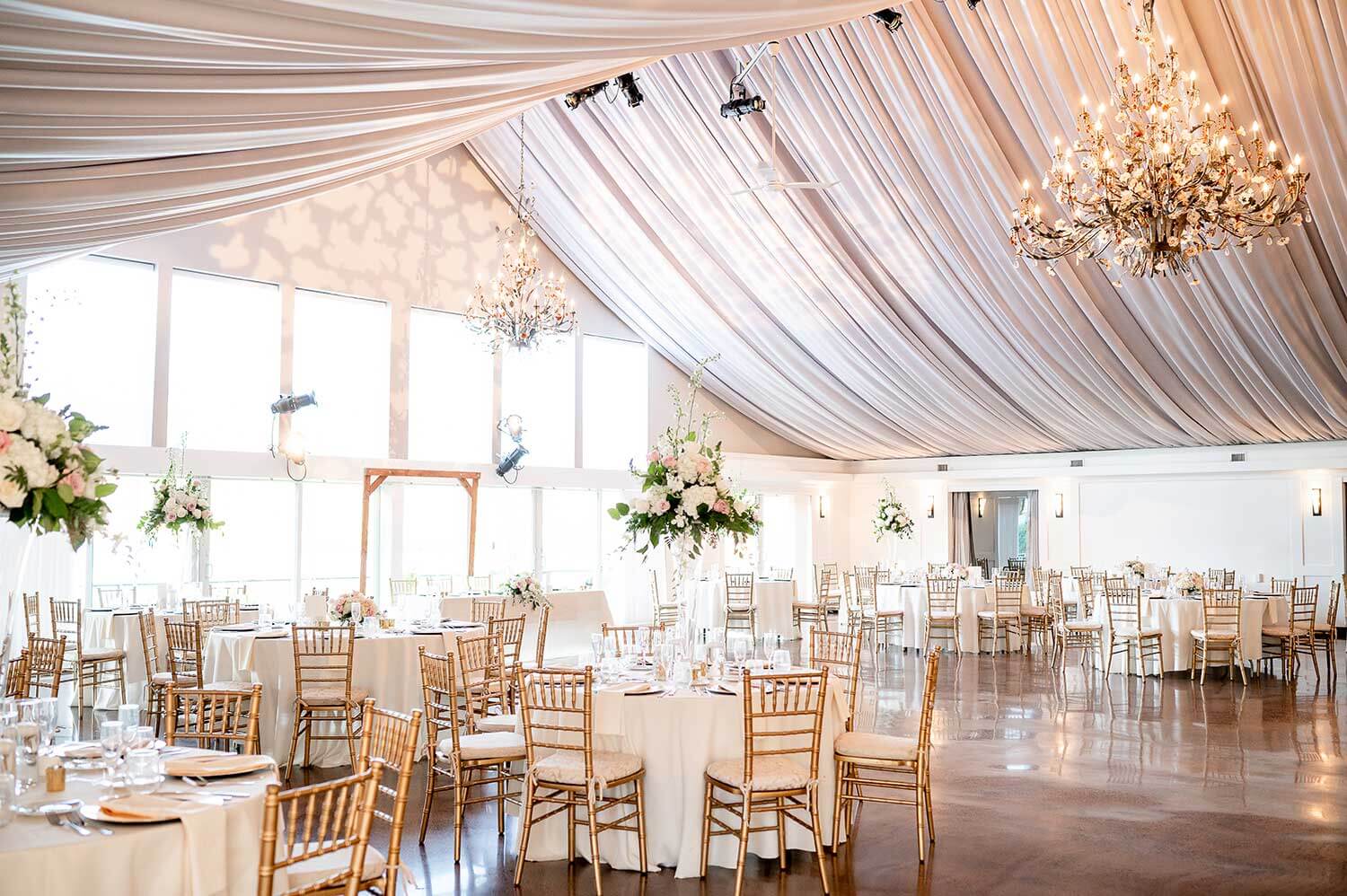 The Lake House Inn's beautifully appointed reception space with endless dancefloor and draped ceiling.