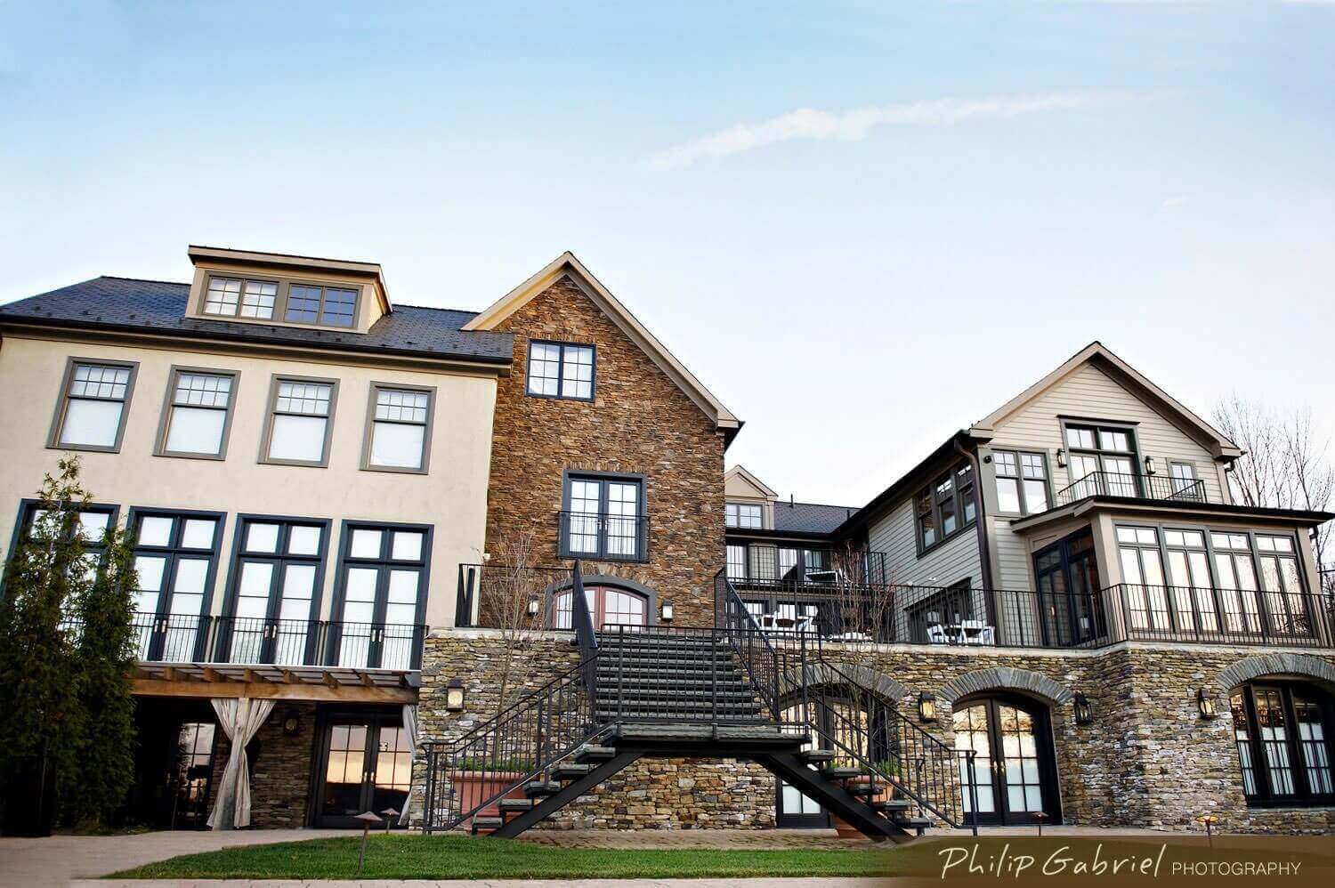 A large stone house with stairs leading up to it.